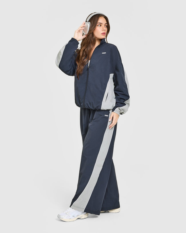 12DAYSONER_OVERSIZED_PIPED_WOVEN_TRACK_JACKET_TRUEBLUE_250930_PDP_1440x1800_03_7b21e6f1-5b6c-4074-924c-3da3826d51b1_650x.jpg