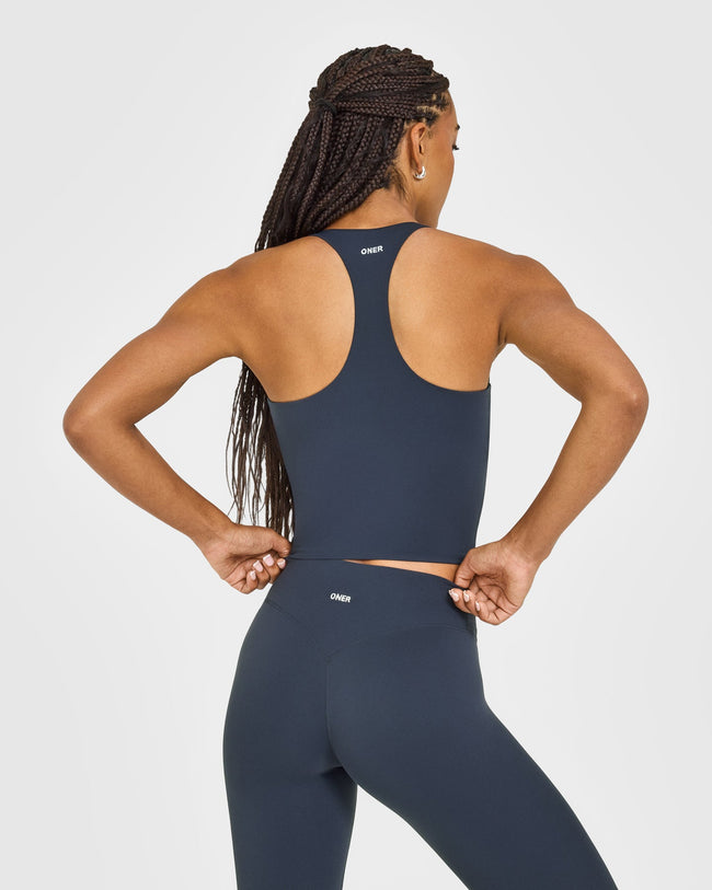 12DAYSONER_SOFTMOTION_RACER_BACK_MID_VEST_BUILT_IN_BRA_SHELF_TRUEBLUE_251105_PDP_1440x1800_02_650x.jpg