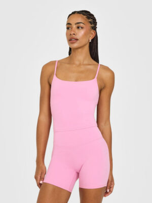 SOFTMOTION STRAPPY MID VEST WITH BUILT IN BRA SHELF WITH WHITE LOGO