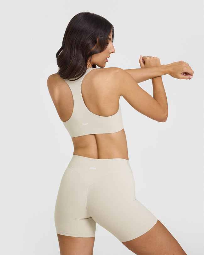 241010_SOFTMOTION_RACER_BACK_SPORTS_BRA_SAND_PDP_1440x1800_02_650x.jpg