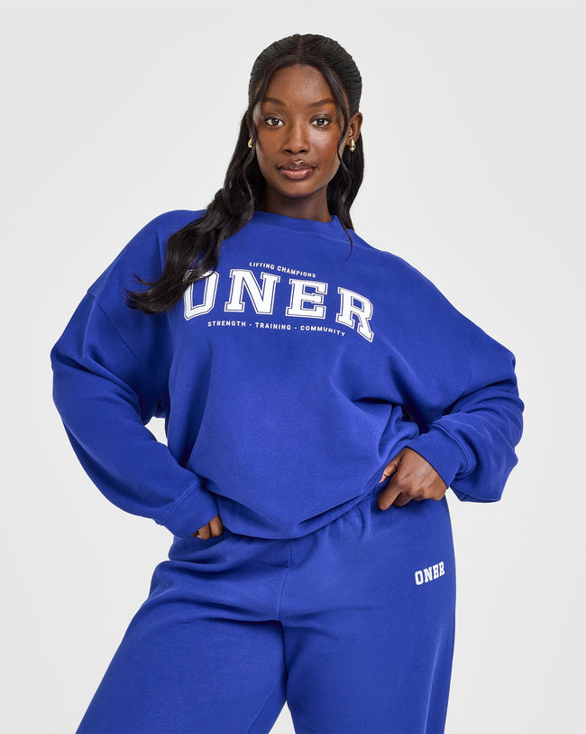 250225_STRONG_IS_A_STATEMENT_MID-WEIGHT_SWEATSHIRT_PRINTED_LOGO_SPACEBLUE_PDP_1440x1800_01_650x.jpg