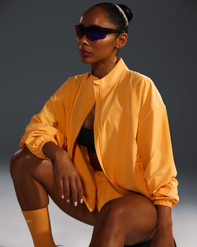 250409_HYBRID_AIRMOVE_JACKET_POWDEREDORANGE_PDP_1440x1800_03_650x.jpg