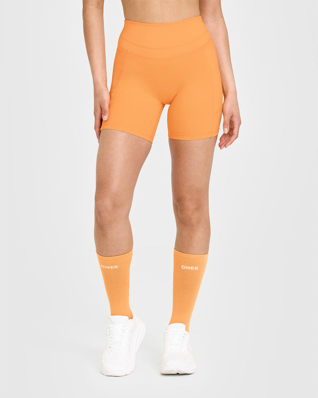 250410_HYBRID_UNIFIED_POCKET_SHORTS_POWDEREDORANGE_PDP_1440x1800_01_650x.jpg