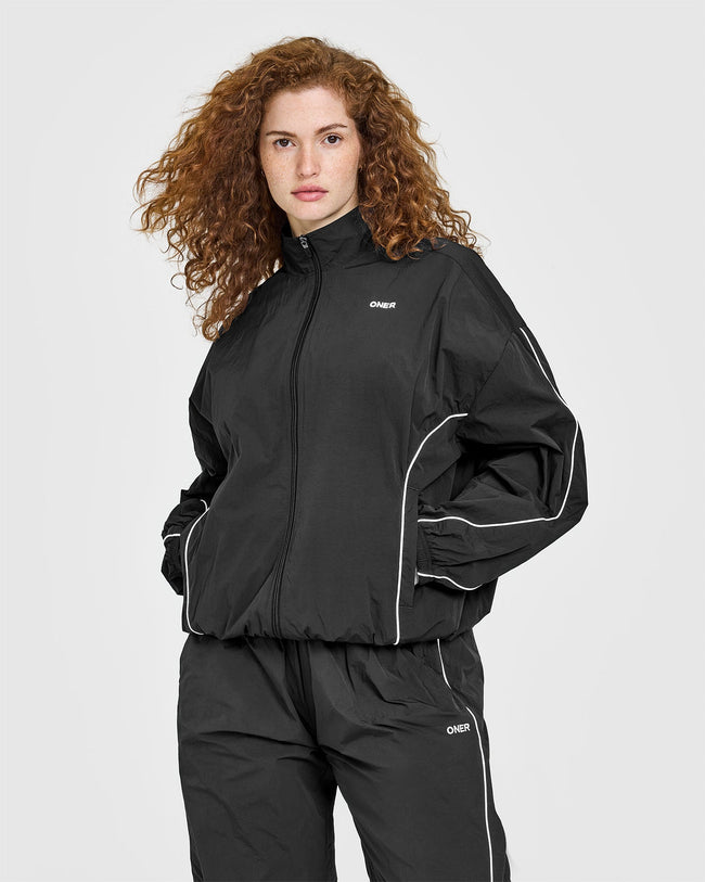 250416_ALWAYSINONER_OVERSIZED_PIPED_WOVEN_TRACK_JACKET_SOFTBLACK_PDP_1440x1800_01_650x.jpg
