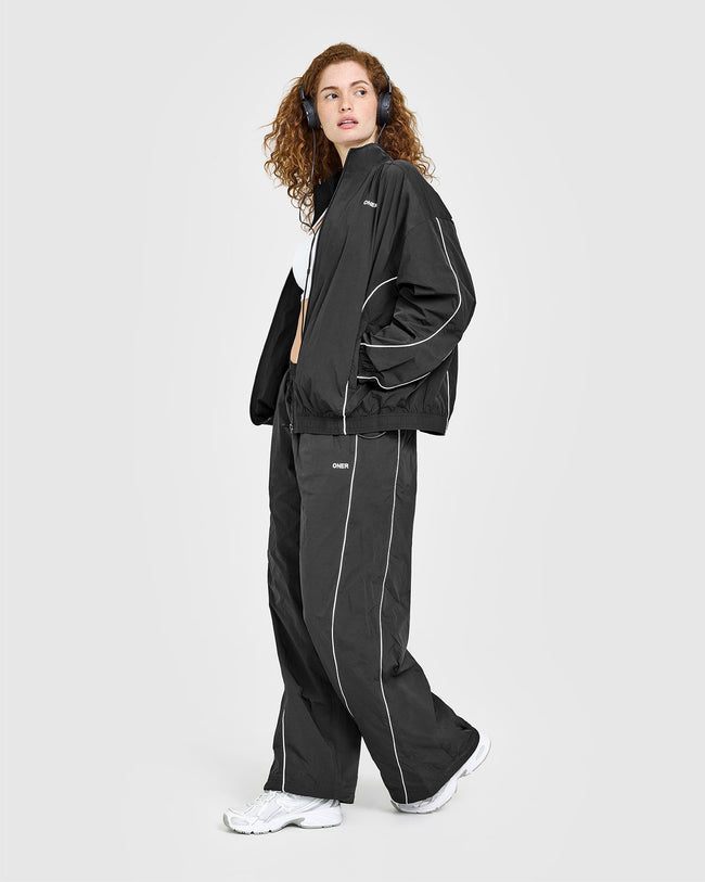 250416_ALWAYSINONER_OVERSIZED_PIPED_WOVEN_TRACK_JACKET_SOFTBLACK_PDP_1440x1800_03_650x.jpg