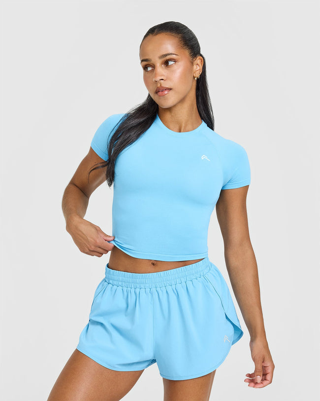 AT_YOUR_PACE_GO_TO_SEAMLESS_FITTED_MID_T-SHIRT_ARCTICBLUE_250618_PDP_1440x1800_01_650x.jpg