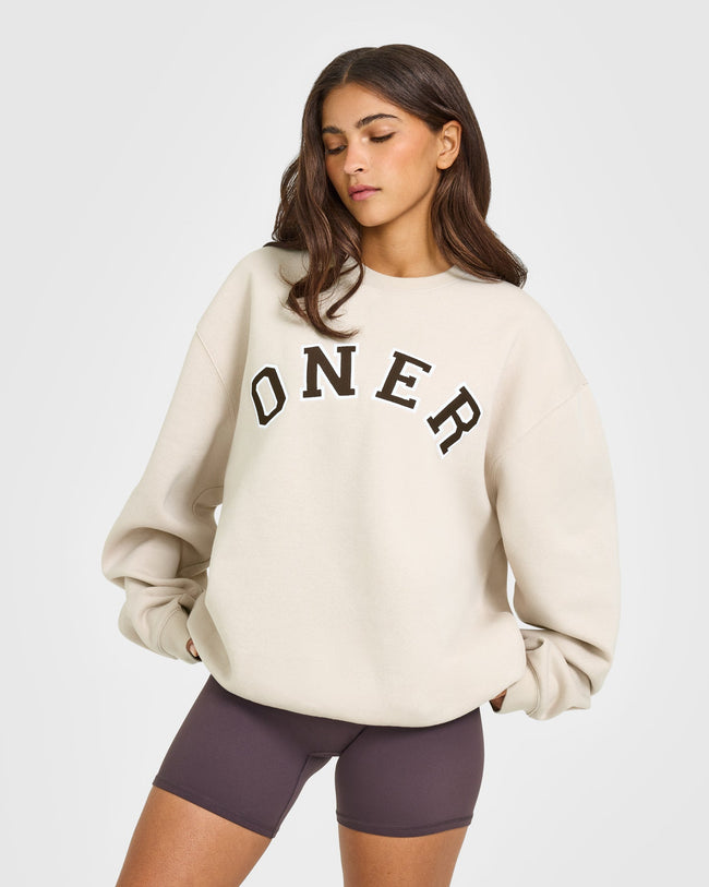 BAU_GRAPHIC_INJECT_FOUNDATIONS_OVERSIZED_ONER_GIRLFRIEND_SWEATSHIRT_SAND_250922_PDP_1440x1800_01_bd47156d-0244-4653-a0e2-0824ae0ae4cd_650x.jpg