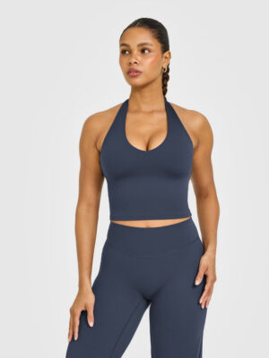 SOFTMOTION HALTER NECK MID VEST WITH BUILT IN BRA SHELF WITH WHITE LOGO