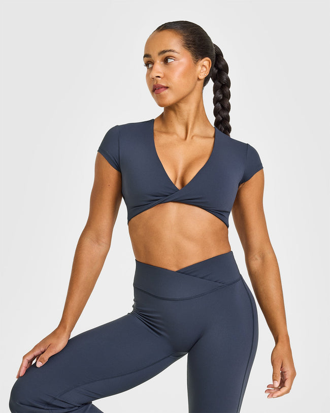 NOOS_UNIFIED_TWIST_FRONT_CROP_TOP_TRUEBLUE_250729_PDP_1440x1800_01_650x.jpg