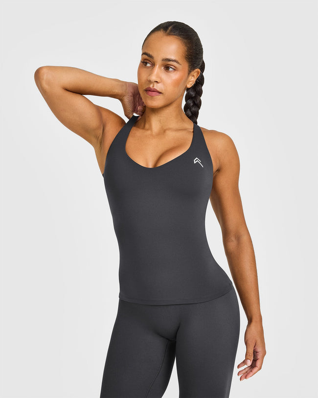 NOOS_UNIFIED_V-NECK_CROSS_BACK_VEST_WHITE_LOGO_COAL_250729_PDP_1440x1800_01_650x.jpg