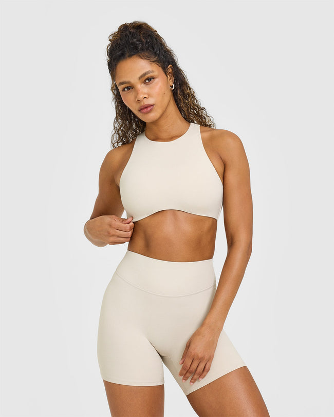 OUTDOOR_ACTIVE_REST_DAY_SOFTMOTION_HIGH_NECK_SPORTS_BRA_SAND_250828_PDP_1440x1800_01_f483346f-e676-4beb-b9d8-27d2b75ea427_650x.jpg