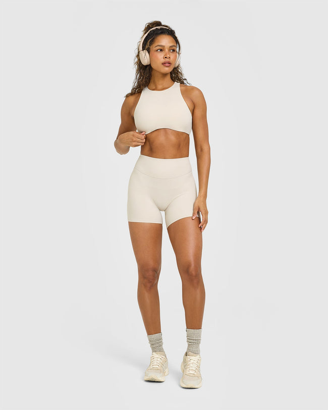 OUTDOOR_ACTIVE_REST_DAY_SOFTMOTION_HIGH_NECK_SPORTS_BRA_SAND_250828_PDP_1440x1800_03_c1d37d92-866d-489a-9036-be320770184c_650x.jpg