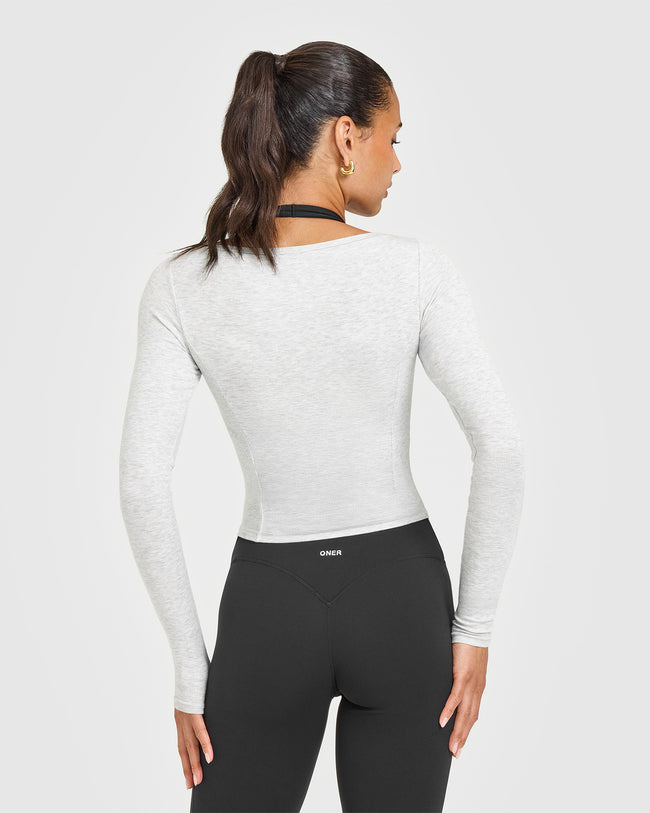 Q3COLOURINJECTION_MELLOW_RIB_V-NECK_MID_LONG_SLEEVE_TOP_LIGHTGREYMARL_250627_PDP_1440x1800_02_85b7eae0-84a0-4e85-95bb-f5bb3e6b0574_650x.jpg
